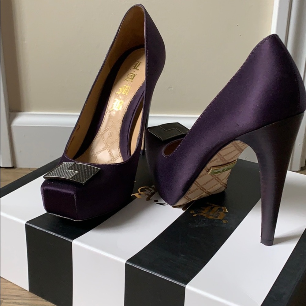 LAMB plum satin hidden platform pump.